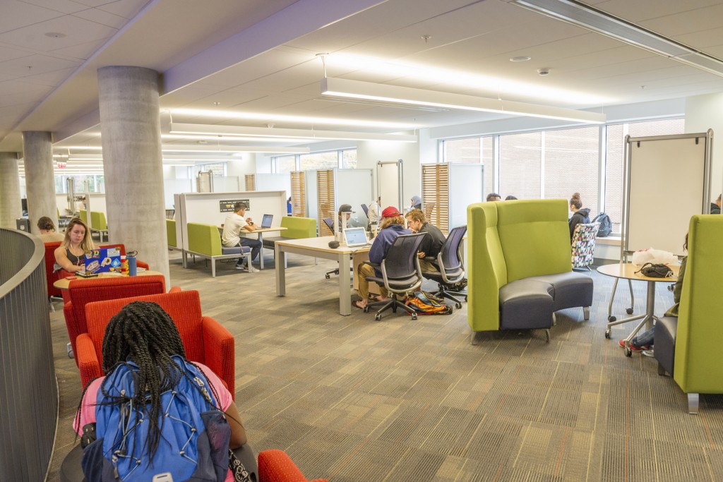 Students seated working together in the library