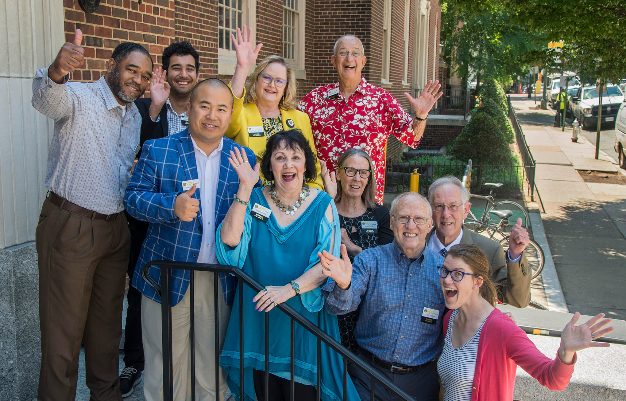 group of volunteers smiling outside Tompkins-McCaw Library