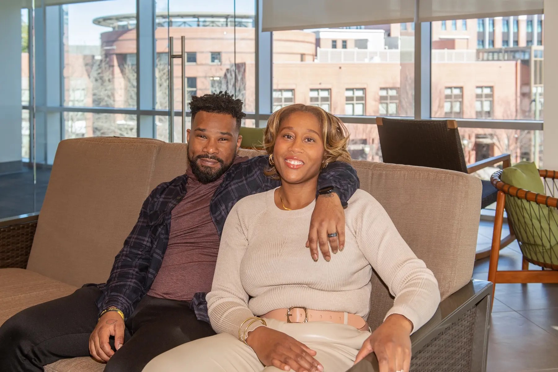 A couple sits together on the third floor of Cabell Library