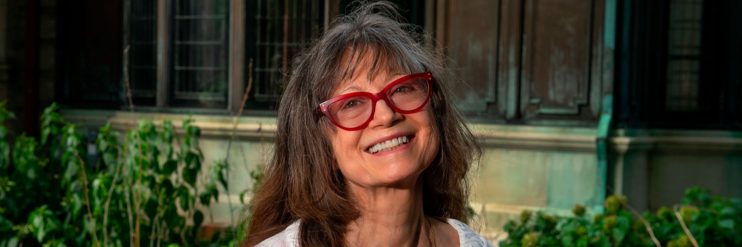 Joan Gaustad, outside the Scott House on VCU's Monroe Park Campus.