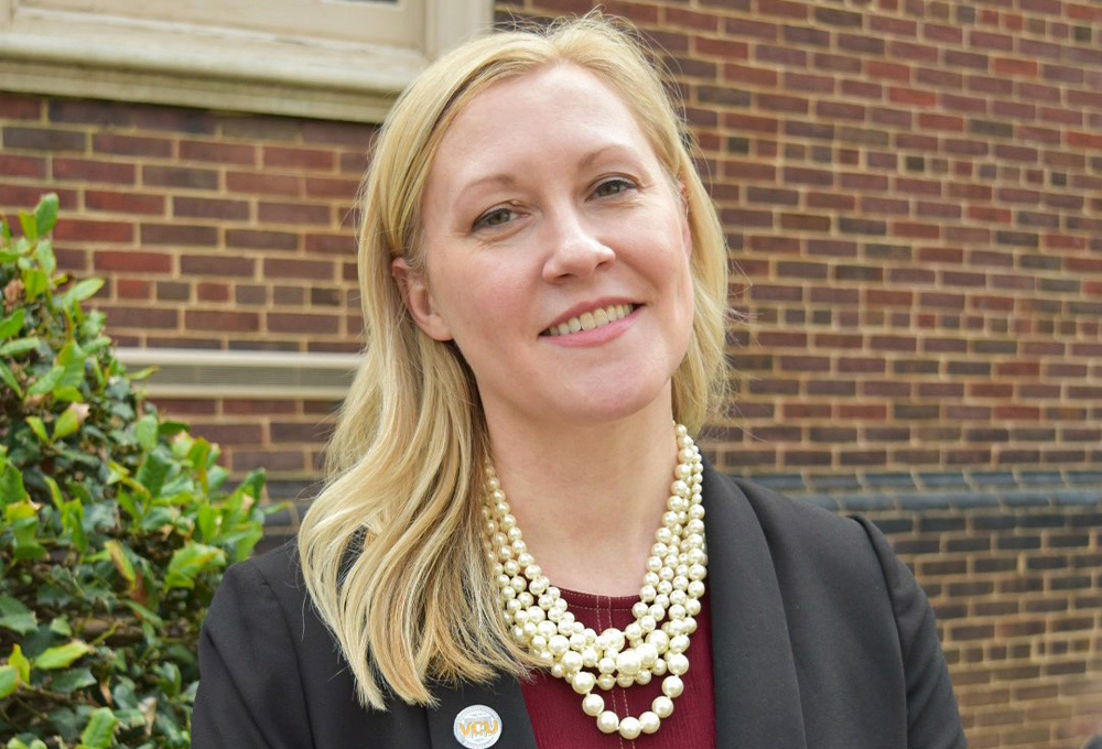 Emily Hurst in front of the Health Sciences Library.